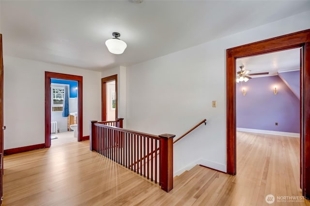 4918 S 3rd Ave, Everett, WA 98203 - hallway with an upstairs landing, radiator, and light wood-style flooring