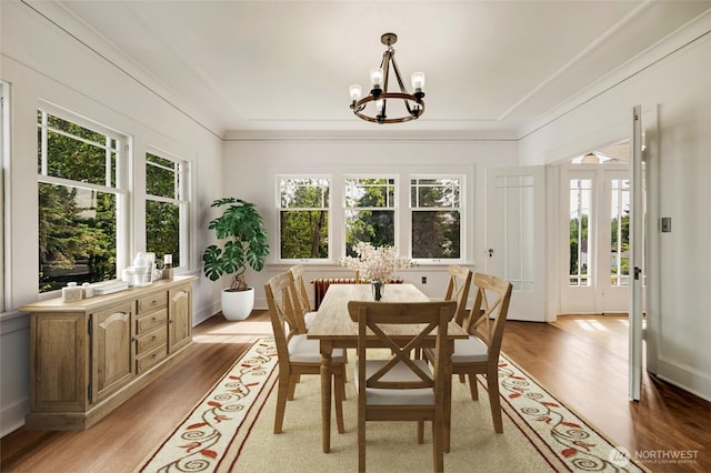 4918 S 3rd Ave, Everett, WA 98203 - dining area featuring a chandelier, healthy amount of natural light, light wood-style floors, and ornamental molding