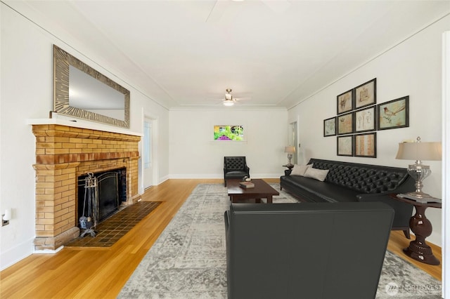 4918 S 3rd Ave, Everett, WA 98203 - living room featuring a ceiling fan, wood finished floors, a fireplace, and ornamental molding