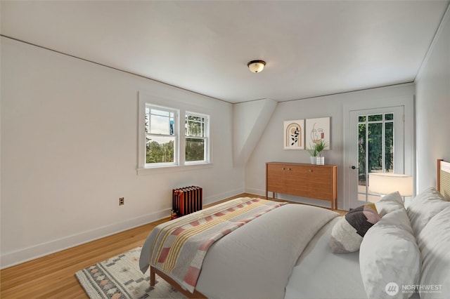 4918 S 3rd Ave, Everett, WA 98203 - bedroom featuring radiator, multiple windows, and wood finished floors