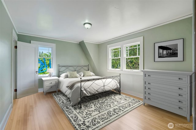 4918 S 3rd Ave, Everett, WA 98203 - bedroom with crown molding, multiple windows, and light wood-type flooring