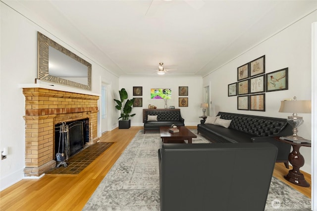 4918 S 3rd Ave, Everett, WA 98203 - living room with ceiling fan, wood finished floors, and a brick fireplace