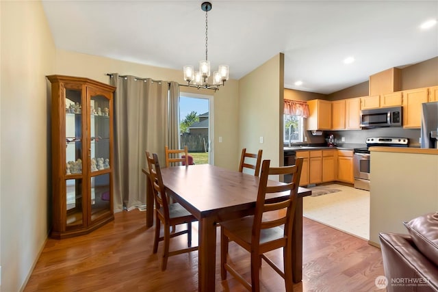 25320 153rd St E, Buckley, WA 98321 - dining room featuring lofted ceiling, a chandelier, and light wood-style floors