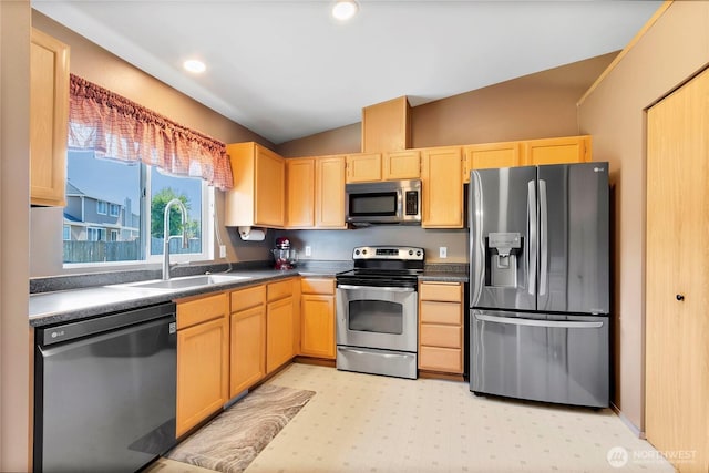 25320 153rd St E, Buckley, WA 98321 - kitchen featuring stainless steel appliances, light brown cabinets, vaulted ceiling, a sink, and dark countertops