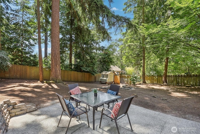 1535 NE 107th St, Seattle, WA 98125 - fenced backyard with a patio and outdoor dining area