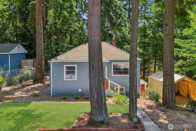 1535 NE 107th St, Seattle, WA 98125 - bungalow featuring a chimney and roof with shingles