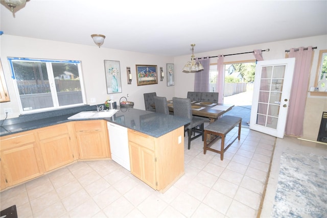 1305 Browns Point Blvd, Tacoma, WA 98422 - kitchen with dishwasher, light brown cabinetry, dark countertops, and light tile patterned floors