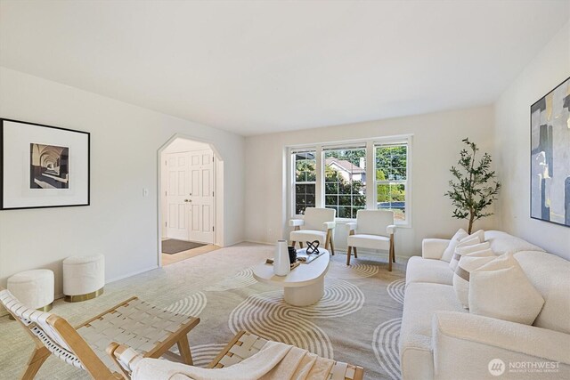 7109 SE 135th Pl, Newcastle, WA 98059 - carpeted living room with arched walkways and baseboards