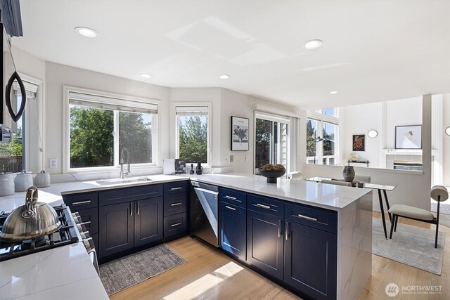 7109 SE 135th Pl, Newcastle, WA 98059 - kitchen with dishwasher, a peninsula, light wood-style floors, recessed lighting, and light stone countertops