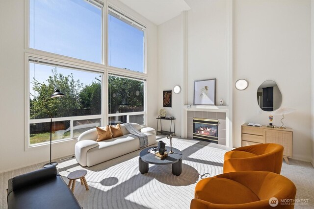 7109 SE 135th Pl, Newcastle, WA 98059 - living room with a towering ceiling, carpet flooring, and a fireplace