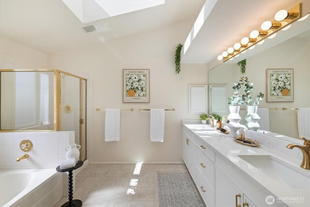 7109 SE 135th Pl, Newcastle, WA 98059 - full bath featuring a skylight, double vanity, a stall shower, a garden tub, and tile patterned floors
