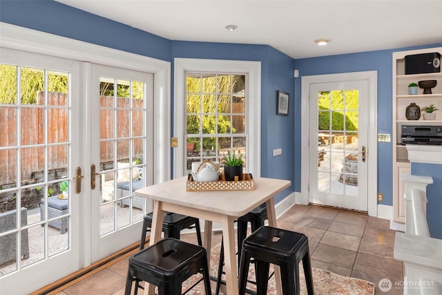 8816 Fauntleroy Way SW, Seattle, WA 98136 - tiled dining space featuring french doors and baseboards