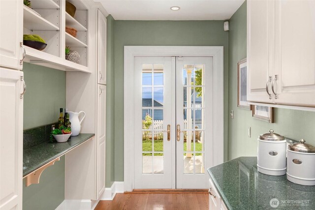 8816 Fauntleroy Way SW, Seattle, WA 98136 - doorway to outside with french doors and wood finished floors