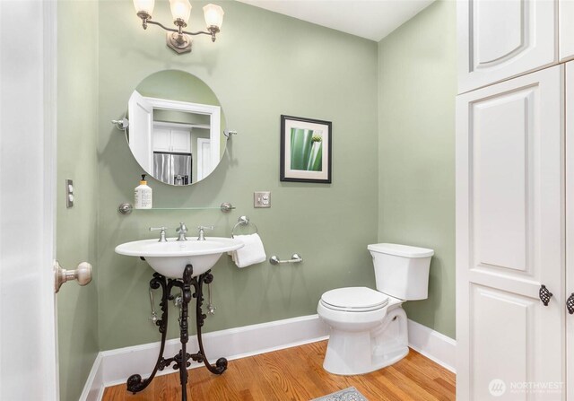 8816 Fauntleroy Way SW, Seattle, WA 98136 - half bathroom with wood finished floors and toilet