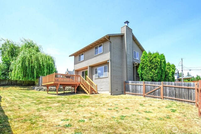 3304 202nd St SW, Lynnwood, WA 98036 - rear view of property featuring a wooden deck, a fenced backyard, a chimney, and stairway