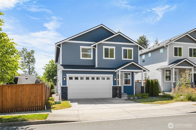 3410 102nd Ave NE, Lake Stevens, WA 98258 - craftsman house with concrete driveway, stone siding, and a garage