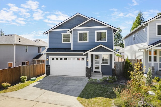 3410 102nd Ave NE, Lake Stevens, WA 98258 - craftsman inspired home featuring an attached garage, concrete driveway, and stone siding