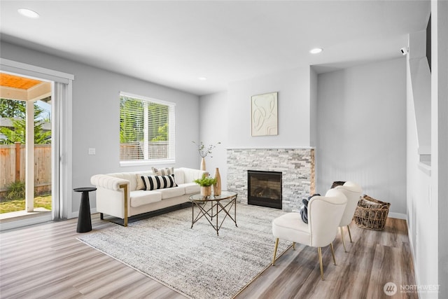 3410 102nd Ave NE, Lake Stevens, WA 98258 - living room featuring wood finished floors, baseboards, a stone fireplace, and recessed lighting