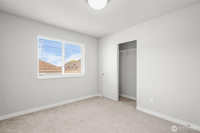 3410 102nd Ave NE, Lake Stevens, WA 98258 - unfurnished bedroom with light colored carpet, baseboards, and a closet
