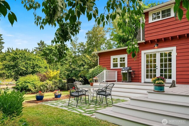 9026 SW 184th St, Vashon, WA 98070 - view of grassy yard featuring french doors, a deck, a patio, and outdoor dining area