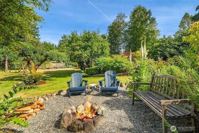 9026 SW 184th St, Vashon, WA 98070 - view of grassy yard featuring an outdoor fire pit and view of scattered trees