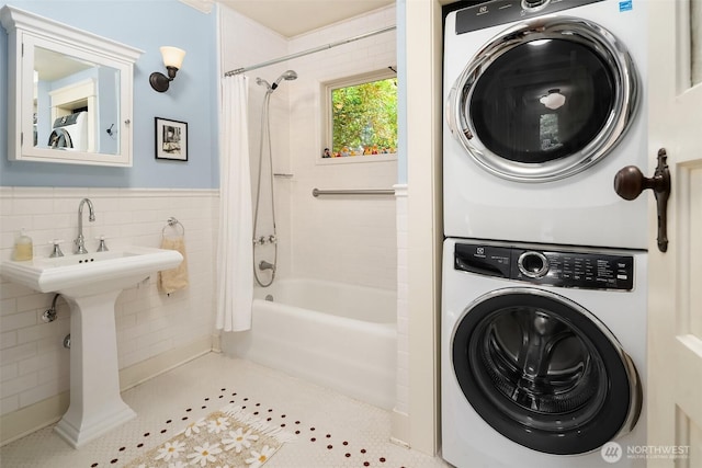 9026 SW 184th St, Vashon, WA 98070 - full bathroom featuring stacked washer / drying machine, shower / bath combination with curtain, and tile patterned floors