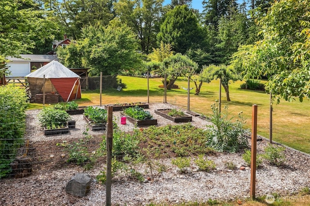 9026 SW 184th St, Vashon, WA 98070 - view of yard featuring a vegetable garden, an outbuilding, and view of scattered trees
