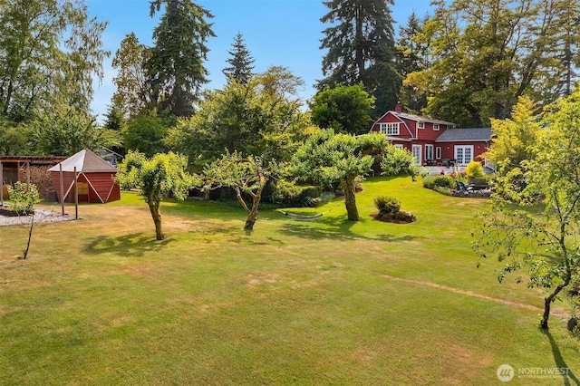 9026 SW 184th St, Vashon, WA 98070 - view of grassy yard with an outbuilding and view of scattered trees