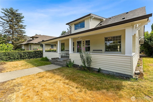 208 Barksdale Ave, Dupont, WA 98327 - bungalow-style home with covered porch and a front yard
