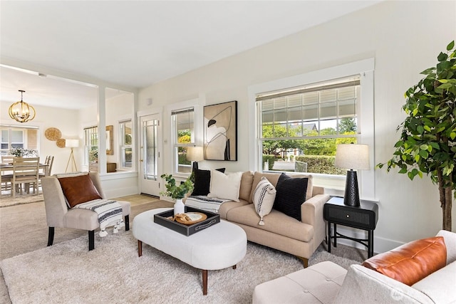 208 Barksdale Ave, Dupont, WA 98327 - carpeted living room with a chandelier and baseboards