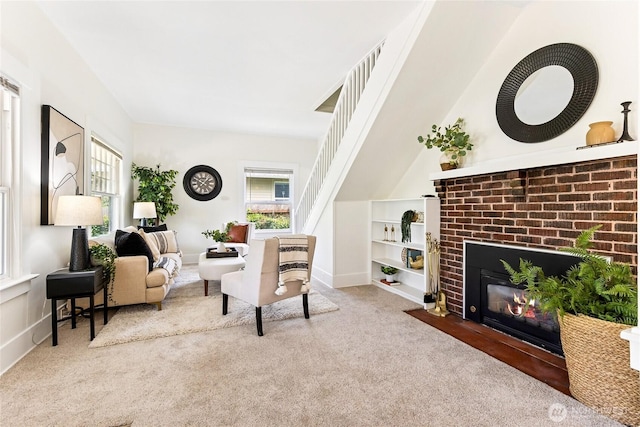 208 Barksdale Ave, Dupont, WA 98327 - living room featuring carpet floors, plenty of natural light, and a brick fireplace
