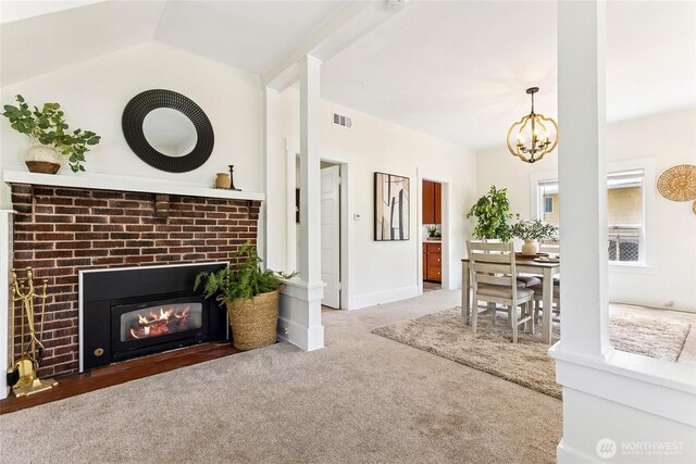 208 Barksdale Ave, Dupont, WA 98327 - living area with carpet flooring, a chandelier, and a brick fireplace
