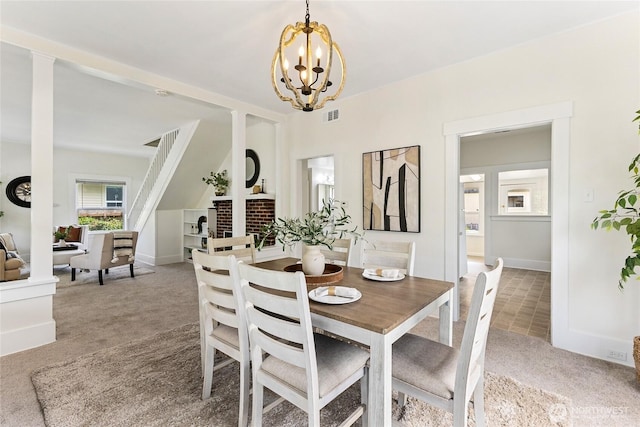208 Barksdale Ave, Dupont, WA 98327 - carpeted dining area with a chandelier and baseboards