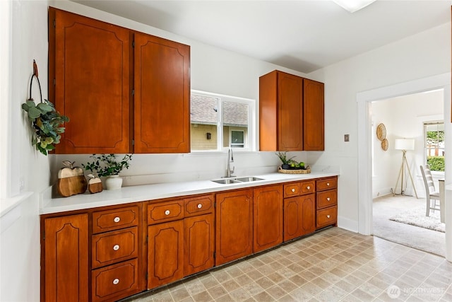 208 Barksdale Ave, Dupont, WA 98327 - kitchen featuring light countertops and brown cabinets