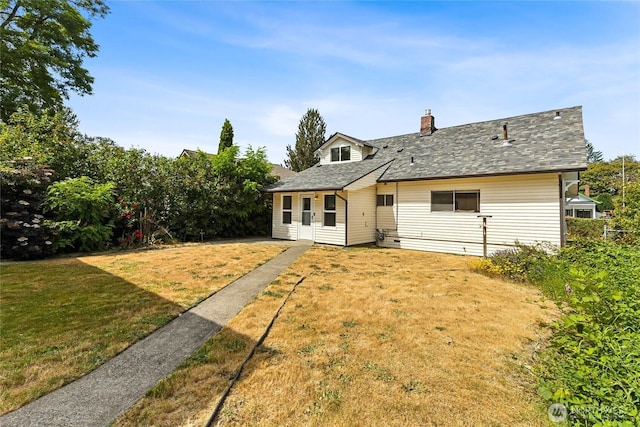 208 Barksdale Ave, Dupont, WA 98327 - rear view of house with a lawn, a chimney, and a shingled roof
