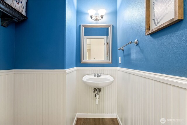 5004 98th Avenue Ct W, University Place, WA 98467 - bathroom featuring wainscoting and wood finished floors