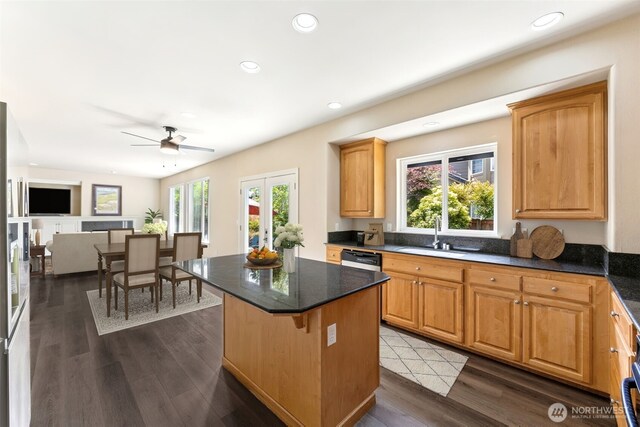 5004 98th Avenue Ct W, University Place, WA 98467 - kitchen with dark wood-style flooring, a kitchen island, recessed lighting, a ceiling fan, and open floor plan