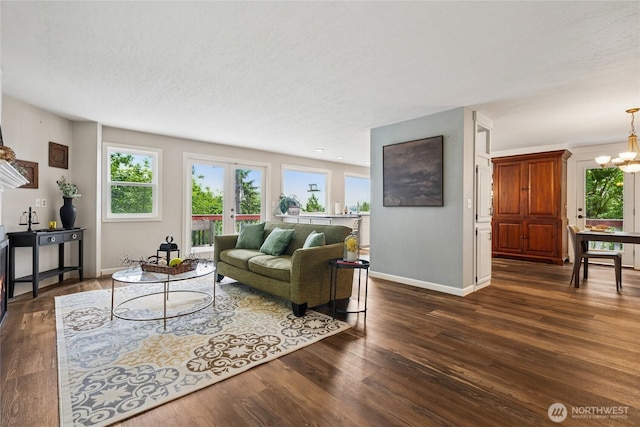 7650 SE Southworth Dr, Port Orchard, WA 98366 - living room with a chandelier and dark wood-style floors
