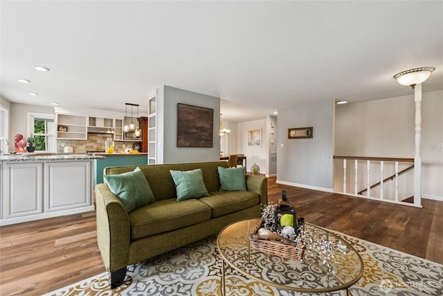 7650 SE Southworth Dr, Port Orchard, WA 98366 - living room with wood finished floors, a chandelier, and recessed lighting
