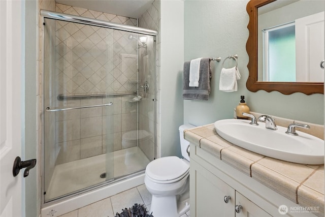 7650 SE Southworth Dr, Port Orchard, WA 98366 - bathroom featuring vanity, a shower stall, and tile patterned floors