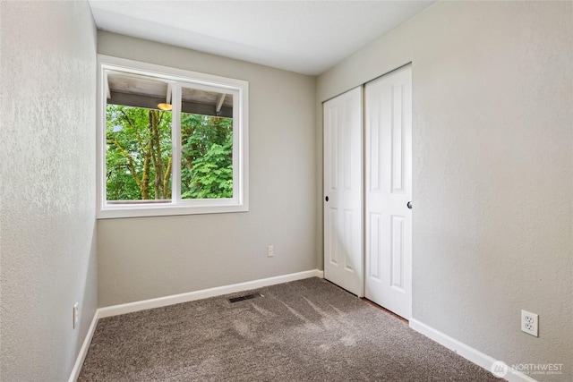 7650 SE Southworth Dr, Port Orchard, WA 98366 - unfurnished bedroom featuring carpet floors and a closet