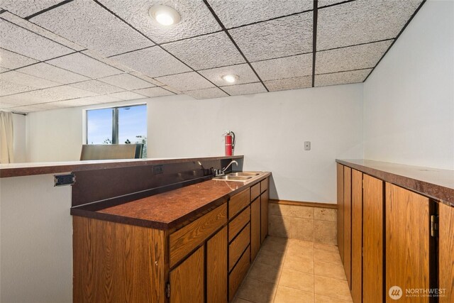 7650 SE Southworth Dr, Port Orchard, WA 98366 - indoor bar with light tile patterned floors and a paneled ceiling