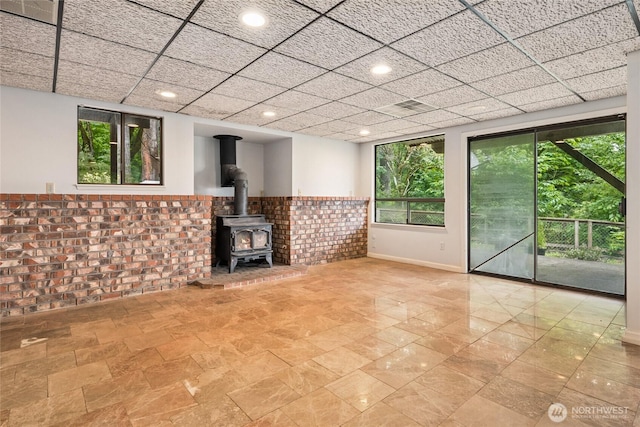 7650 SE Southworth Dr, Port Orchard, WA 98366 - unfurnished living room with a wood stove