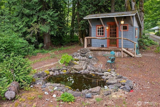 7650 SE Southworth Dr, Port Orchard, WA 98366 - view of outdoor structure with a garden pond