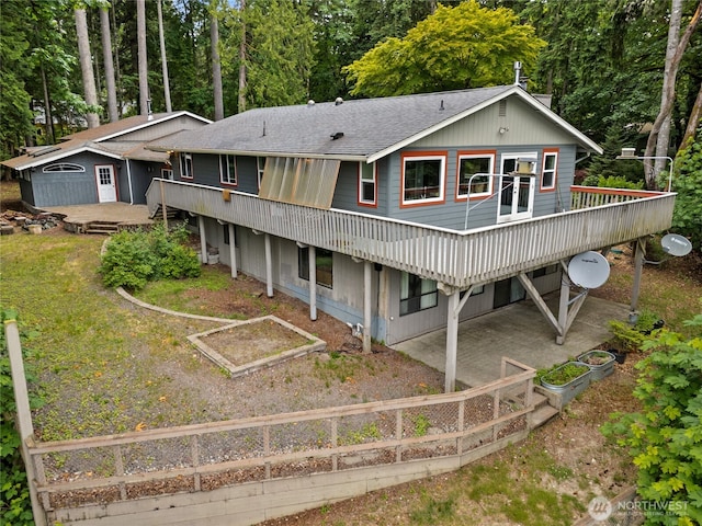 7650 SE Southworth Dr, Port Orchard, WA 98366 - rear view of property with a wooden deck, roof with shingles, and a patio area