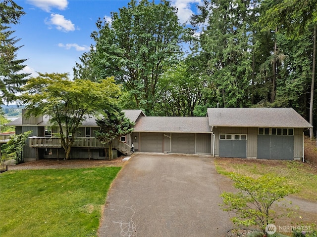 7650 SE Southworth Dr, Port Orchard, WA 98366 - view of front of home with driveway, a garage, and a front lawn