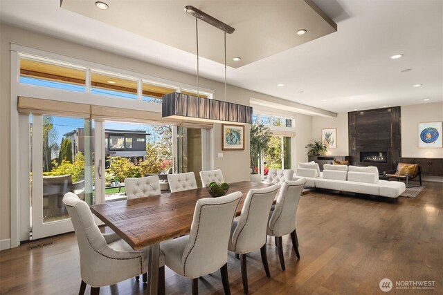 212 5th Ave W, Kirkland, WA 98033 - dining area featuring dark wood-style flooring, recessed lighting, and a premium fireplace