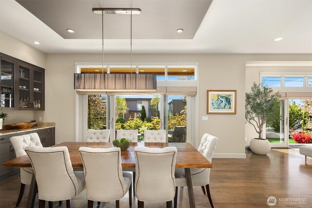 212 5th Ave W, Kirkland, WA 98033 - dining area featuring wood finished floors, recessed lighting, baseboards, and a tray ceiling