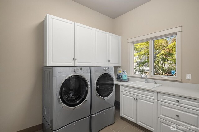 212 5th Ave W, Kirkland, WA 98033 - washroom with cabinet space, separate washer and dryer, and light tile patterned floors