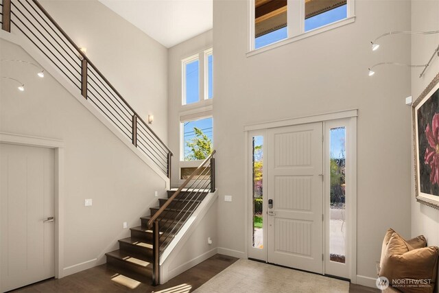 212 5th Ave W, Kirkland, WA 98033 - entryway featuring a high ceiling, wood finished floors, stairway, and baseboards